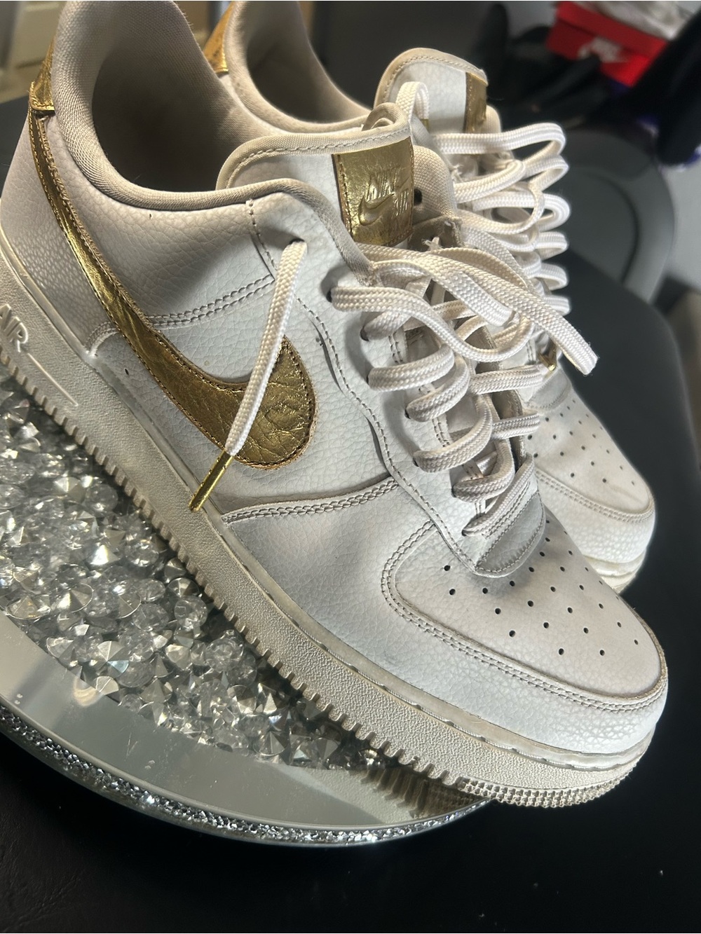 Nike White Low-Top Athletic Sneakers with Gold Swoosh